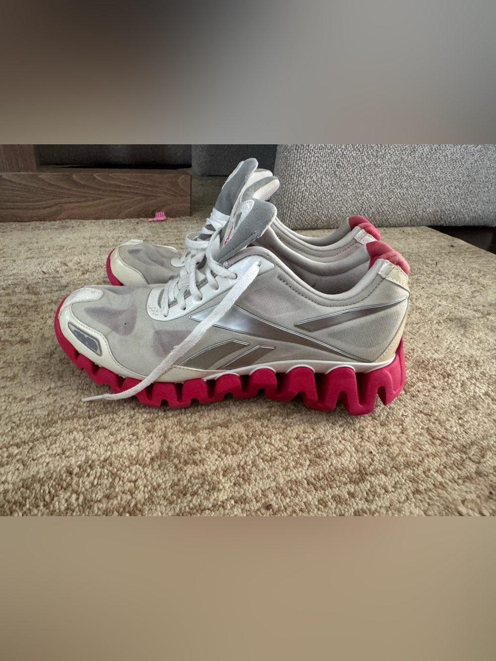 Reebok Women’s White Athletic Sneakers with Pink Zigzag Sole